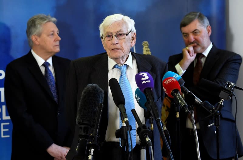 FILE PHOTO: Seamus Mallon speaks as Peter Robinson and John Alderdice look on at an event to celebrate the 20th anniversary of the Good Friday Agreement, in Belfast