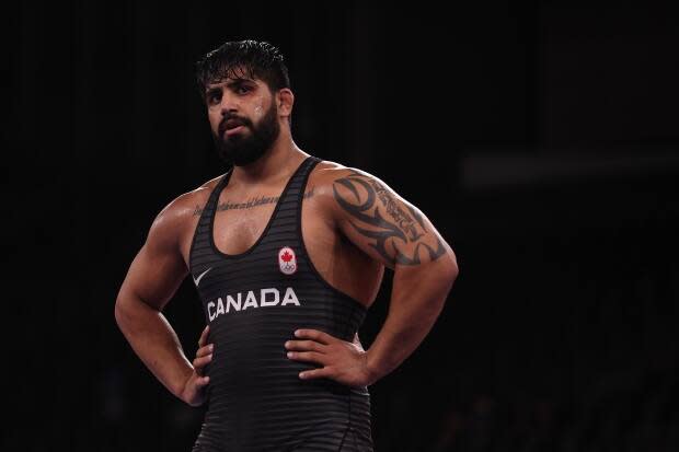 Surrey, B.C., native Amar Dhesi, shown in this file photo at the Tokyo Olympic Games, lost 8-3 to American Nicholas Gwiazdowski in his opening match at the senior world championships in Oslo, Norway on Saturday. (Maddie Meyer/Getty Images - image credit)