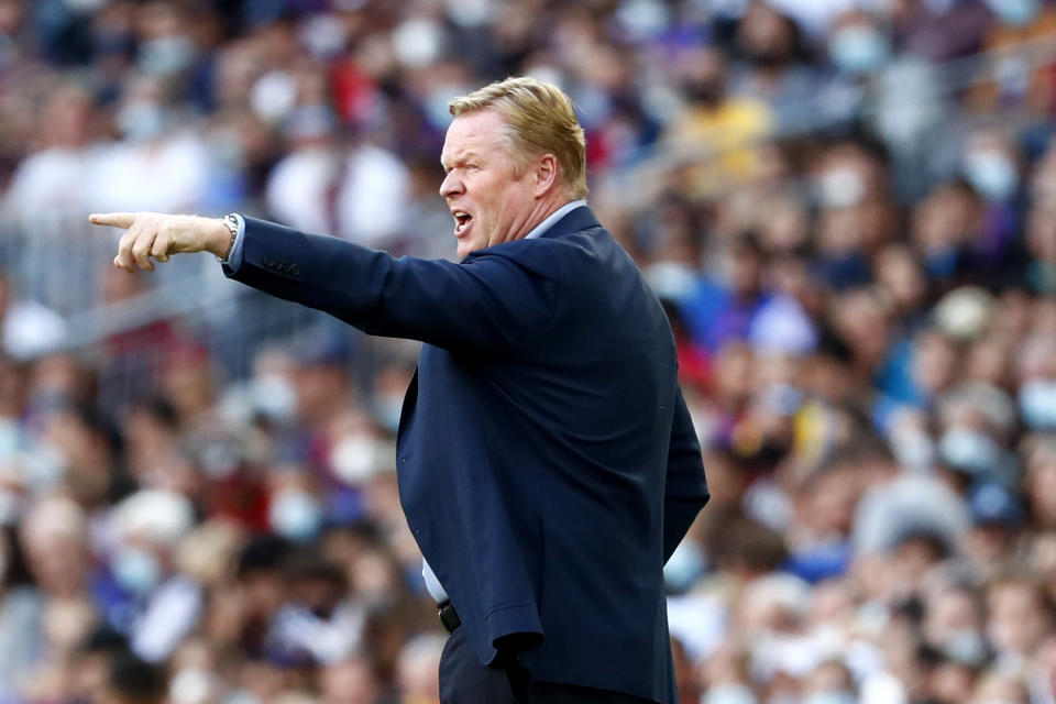 Barcelona's head coach Ronald Koeman gestures during the Spanish La Liga soccer match between FC Barcelona and Real Madrid at the Camp Nou stadium in Barcelona, Spain, Sunday, Oct. 24, 2021. (AP Photo/Joan Monfort)