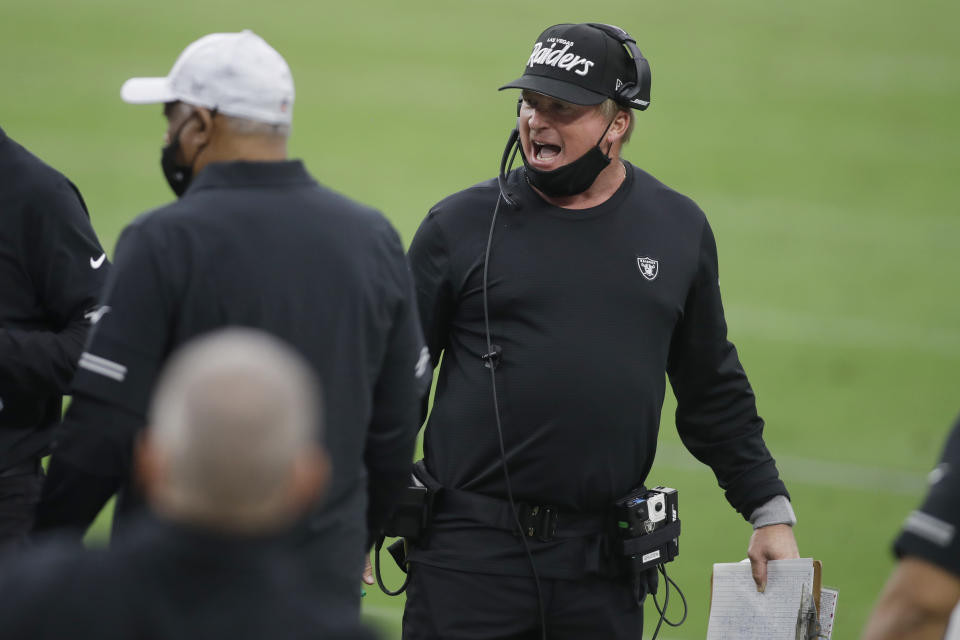 Las Vegas Raiders head coach Jon Gruden speaks on the sideline during the first half of an NFL football game against the Buffalo Bills, Sunday, Oct. 4, 2020, in Las Vegas. (AP Photo/Isaac Brekken)