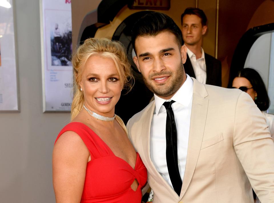 Britney Spears and Sam Asghari on a red carpet in 2019.