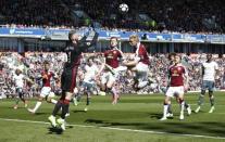 Britain Football Soccer - Burnley v Manchester United - Premier League - Turf Moor - 23/4/17 Manchester United's David De Gea gathers from Burnley's Ben Mee Reuters / Andrew Yates Livepic