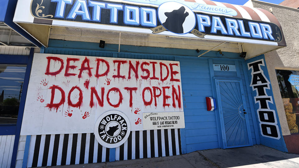 Wolfpack Tattoo in Las Vegas posted a sign on their shop, reading "Dead inside. Do not open", amid the coronavirus pandemic, which forced non-essential businesses to close their doors. Source: Getty