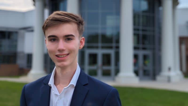 Eli Tillemann poses for a photo in front of his school, Thomas Jefferson High School for Science and Technology, in Alexandria, Virginia.  