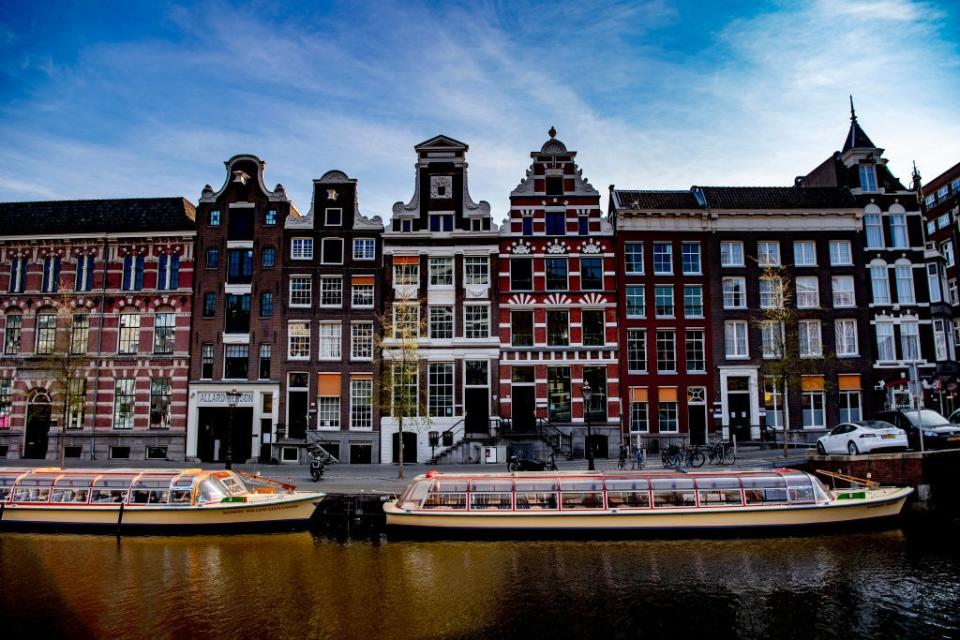 Empty tour boats in Amsterdam - getty