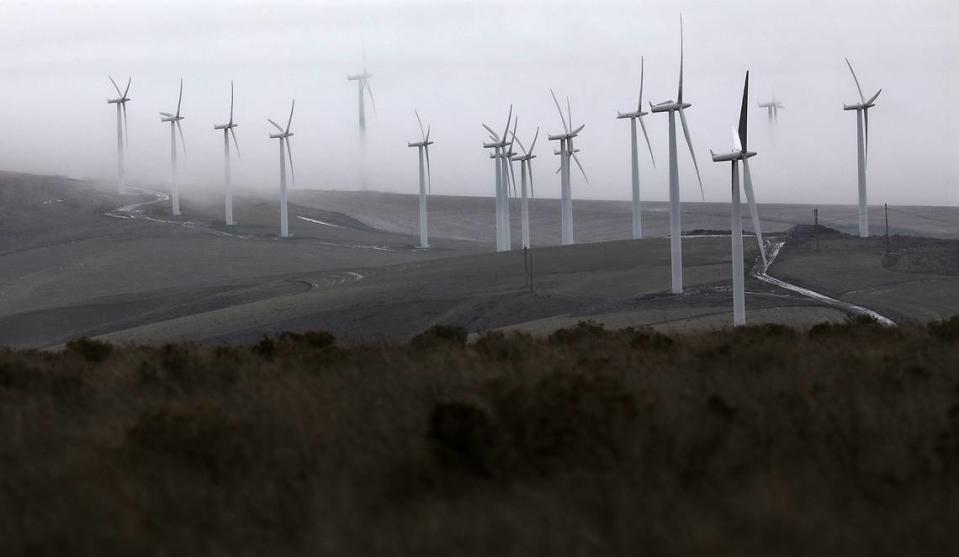 Early morning low clouds, shroud the wind turbines south of the Kennewick on Jump Off Joe butte south of Kennewick.