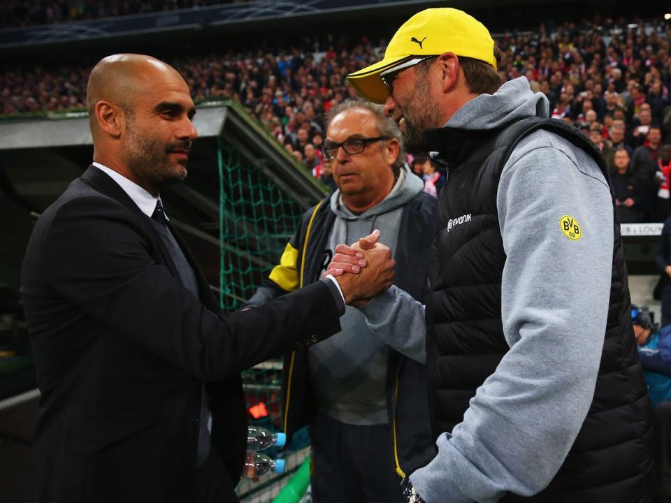 Jurgen Klopp and Pep Guardiola meet at the DFB semi-final match between Borussia Dortmund and Bayern Munich in 2015 (Getty)