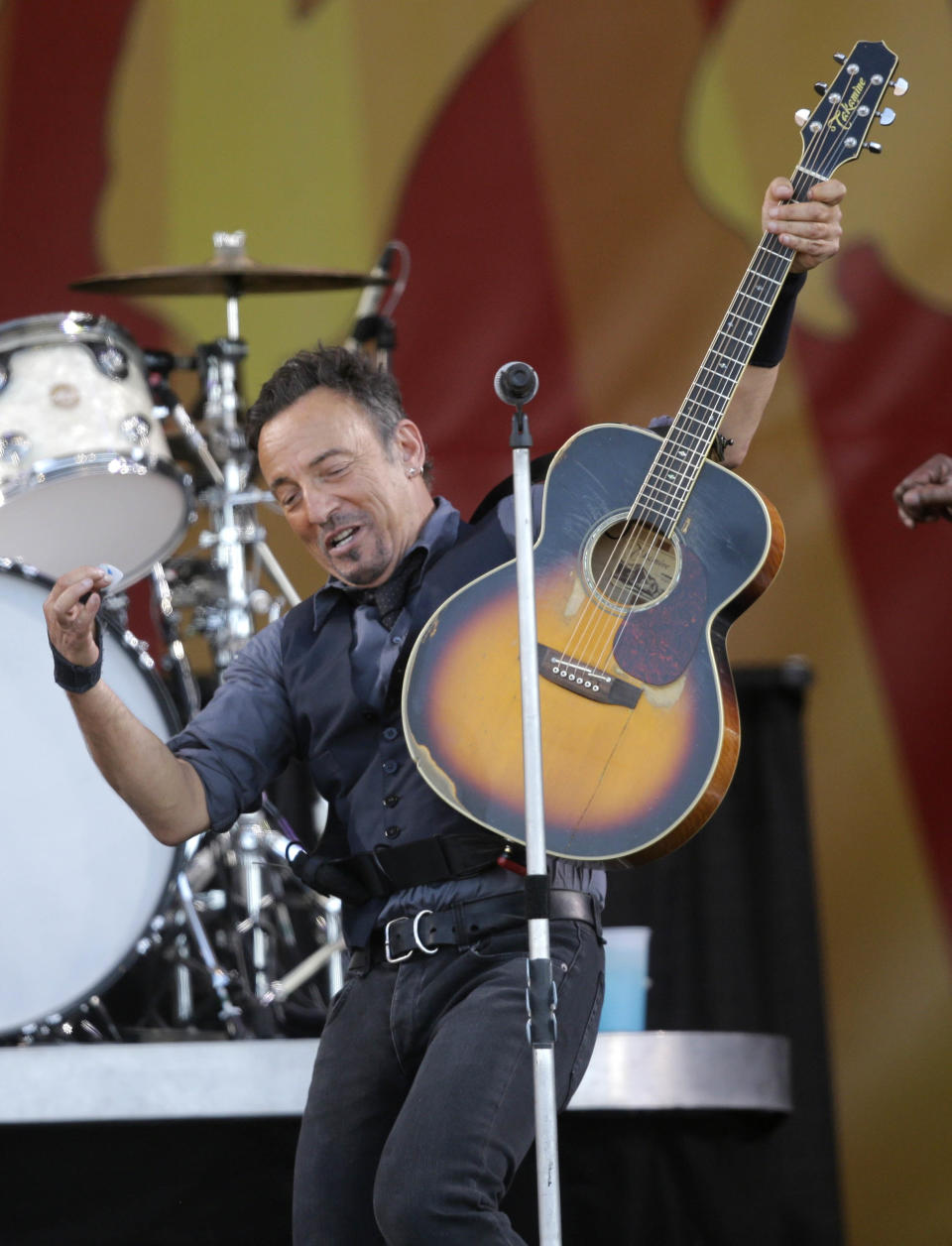 Bruce Springsteen performs at the New Orleans Jazz and Heritage Festival in New Orleans, Saturday, May 3, 2014. (AP Photo/Gerald Herbert)