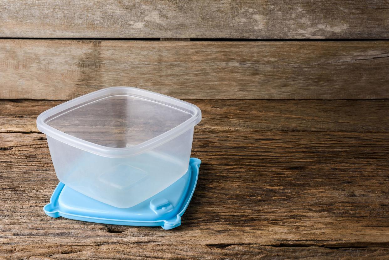 empty tupperware, containers for food on wooden table background