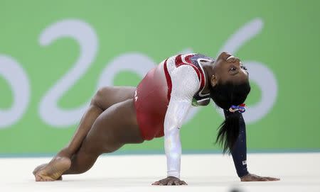 Simone Biles competes on the floor exercise. REUTERS/Damir Sagolj