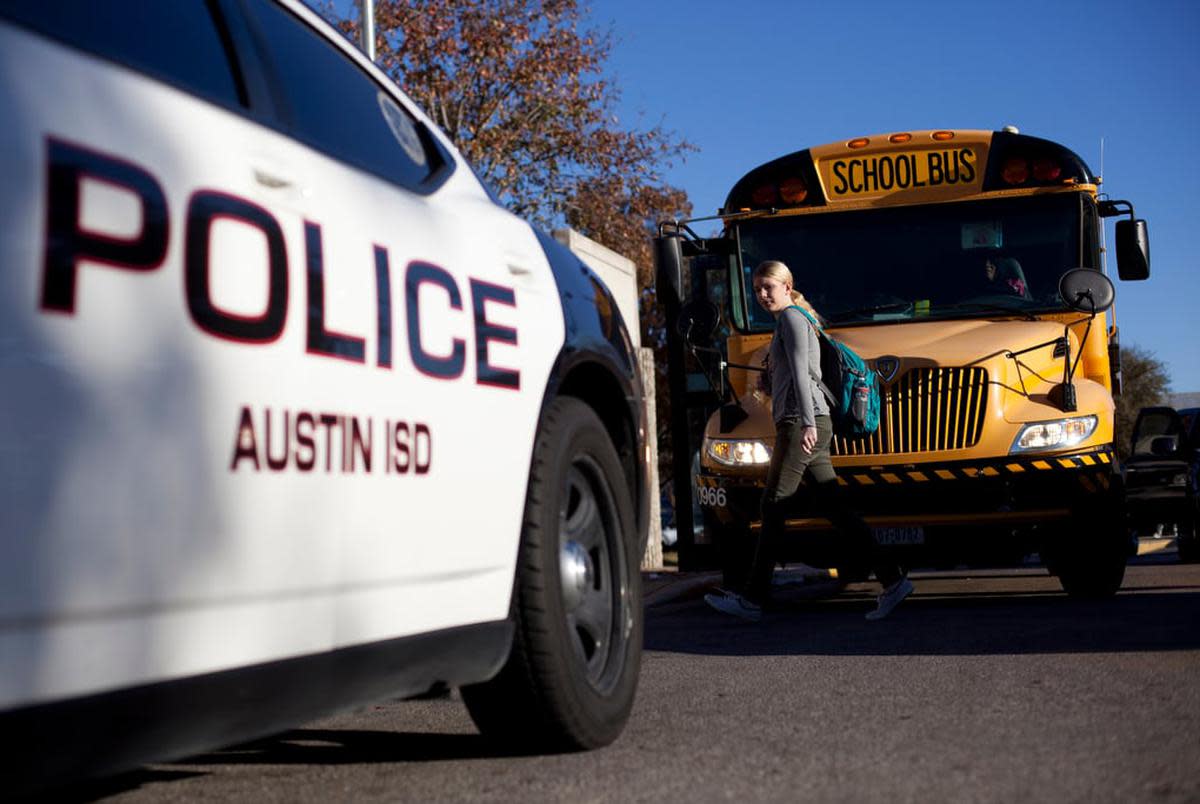 An Austin Independent School District police vehicle sits outside of McCallum High School in Austin, on Dec. 28, 2012.