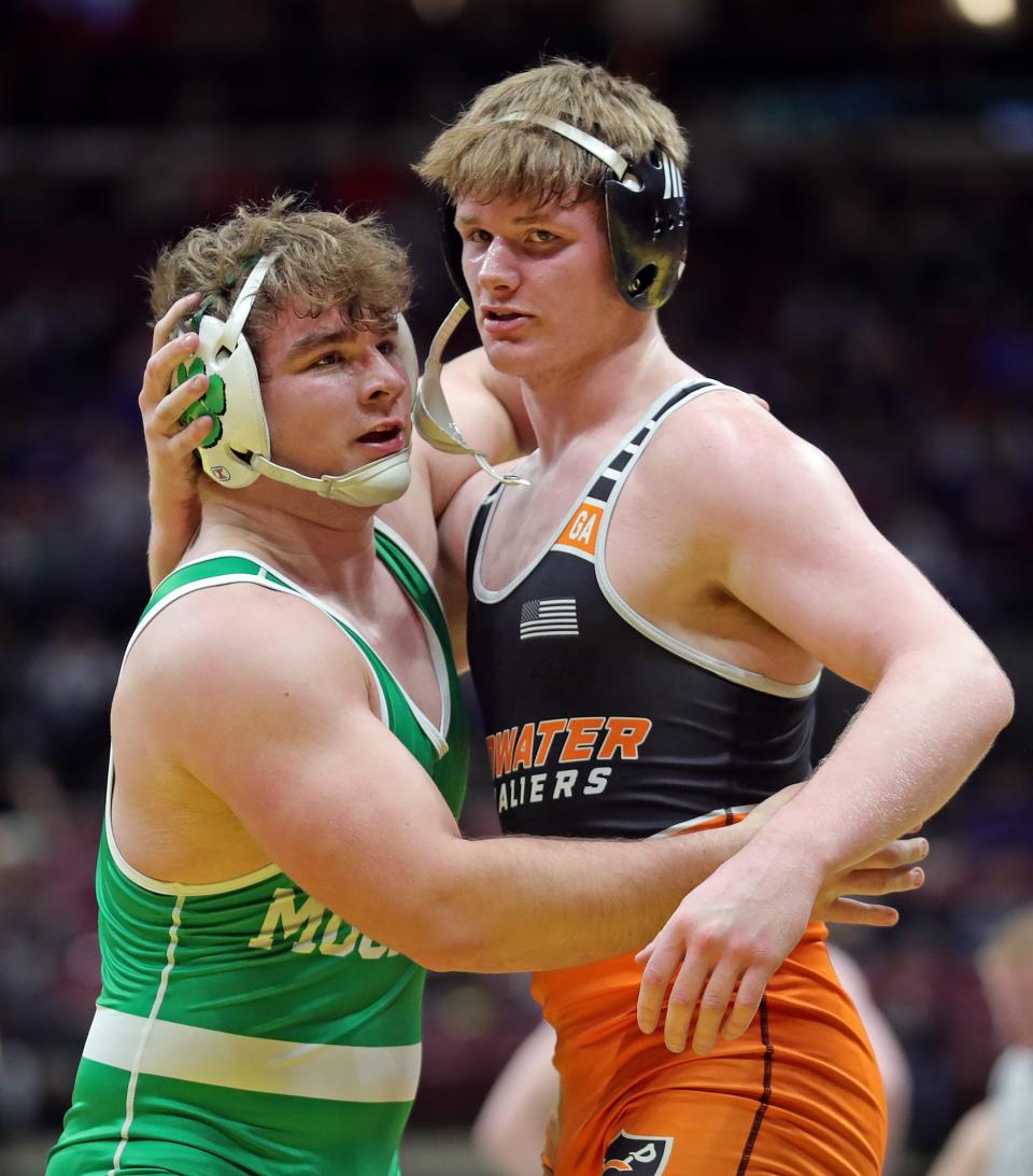 Tyler Shellenbarger of Mogadore, left, hugs Will Fox of Coldwater after beating him in a  215-pound Division III quarterfinal match in the OHSAA State Wrestling Tournament at the Jerome Schottenstein Center, Saturday, March 11, 2023, in Columbus, Ohio.