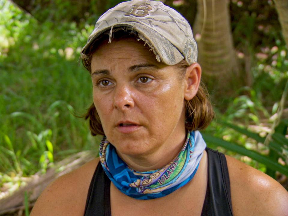 Elaine Stott appears wearing a hat and neck gaiter on Survivor