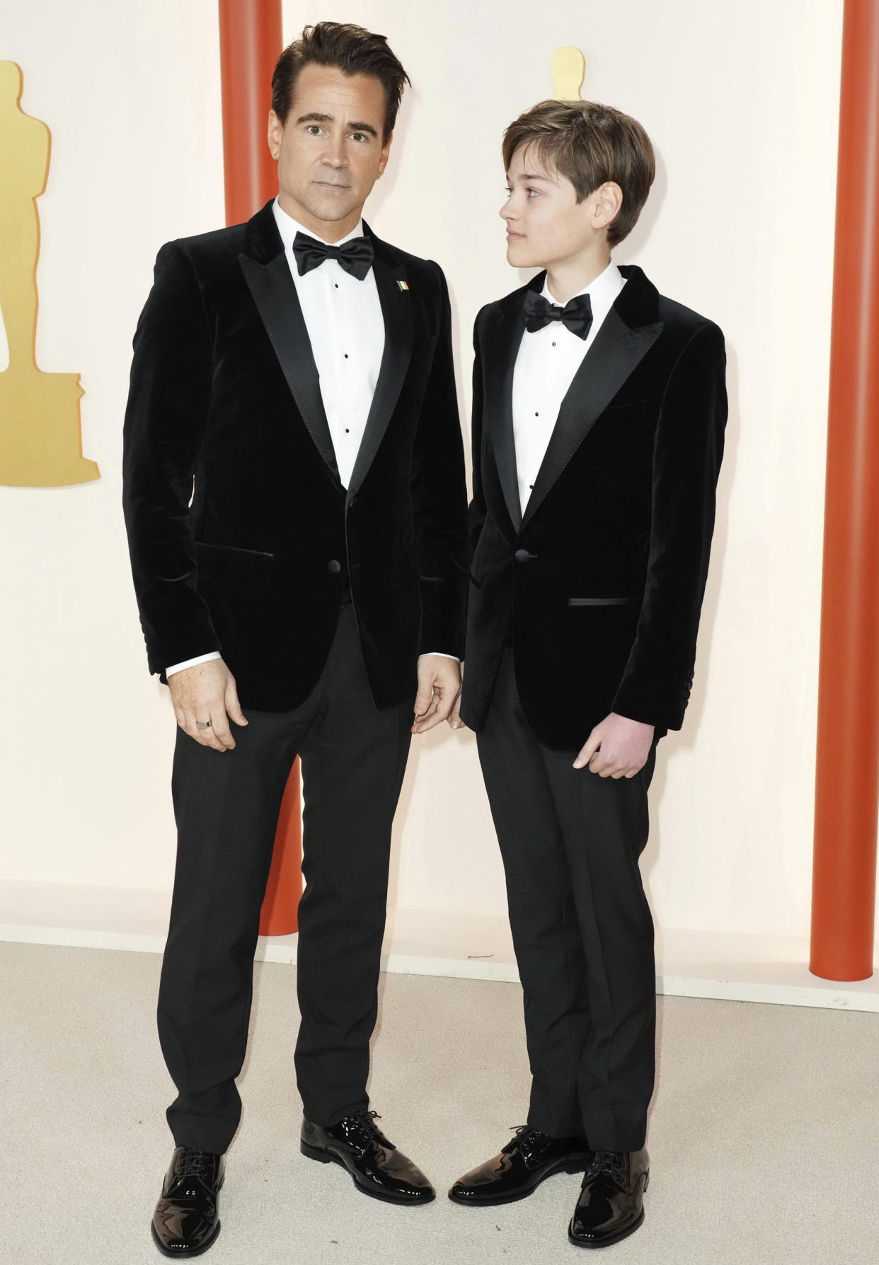 Colin Farrell and Henry Tadeusz Farrell arrive at the Oscars on  March 12, 2023 in Los Angeles. (Jordan Strauss / AP)