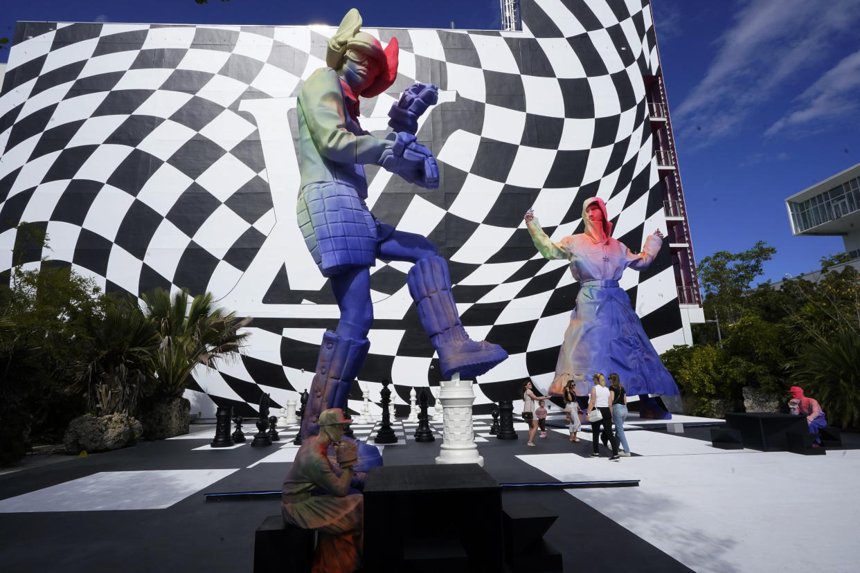 Sculptures designed by Louis Vuitton are displayed in Miami's Design District, Tuesday, Nov. 30, 2021, in Miami. The display is part of Art Basel and related art events that start this week. Louis Vuitton opened a new men's store and will host an exclusive menswear fashion show on a private island. (AP Photo/Marta Lavandier)