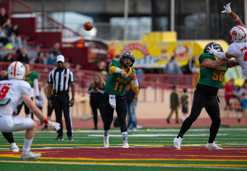 Law Hogs quarterback Jace Sloan throws downfield against the Fire Dogs in the 50th Pig Bowl on Saturday at Hughes Stadium. Sloan was one of the game’s MVPs. Nathaniel Levine/nlevine@sacbee.com