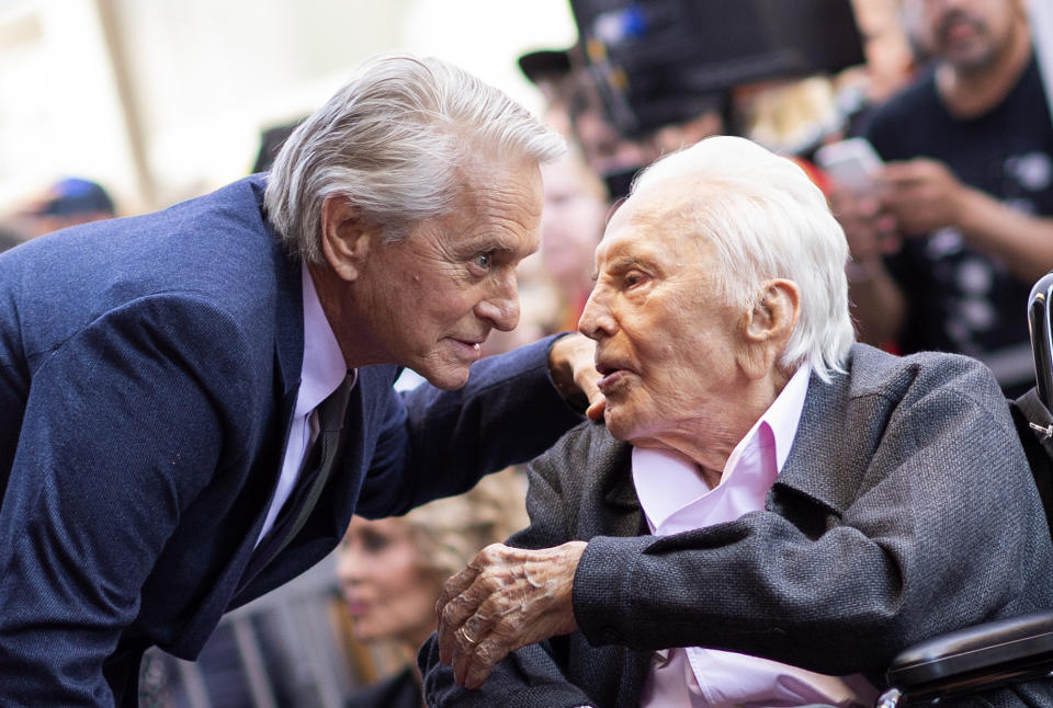 Actor Kirk Douglas (R) attends a ceremony honoring his son actor Michael Douglas (L) with a Star on Hollywood Walk of Fame, in Hollywood, California on November 6, 2018. (Photo by VALERIE MACON / AFP)        (Photo credit should read VALERIE MACON/AFP via Getty Images)