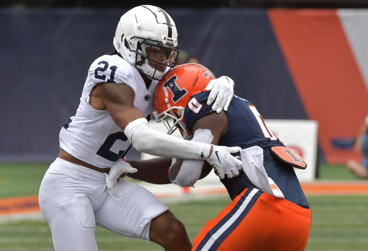 Sep 16, 2023; Champaign, Illinois, USA;  Penn State Nittany Lions safety Kevin Winston Jr. (21) tackles Illinois Fighting Illini running back Josh McCray (0) after McCray caught a short pass during the second half at Memorial Stadium. Mandatory Credit: Ron Johnson-USA TODAY Sports