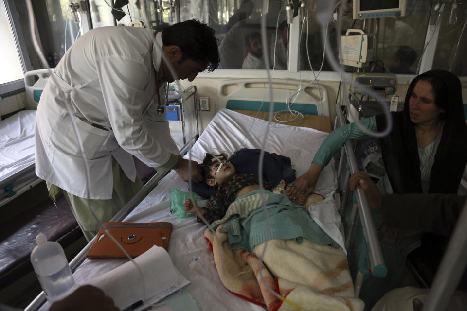 In this Oct. 15, 2019 photo, an Afghan girl receives treatment for respiratory problems at a pediatric hospital, in Kabul, Afghanistan. Afghanistan’s authorities are trying to tackle pollution in the country’s capital, which may be even deadlier than 18-year-old war. The research group State of Global Air said more than 26,000 deaths could be attributed to air pollution in 2017, compared to 3,483 civilians killed that year in the Afghan war. (AP Photo/Rahmat Gul)