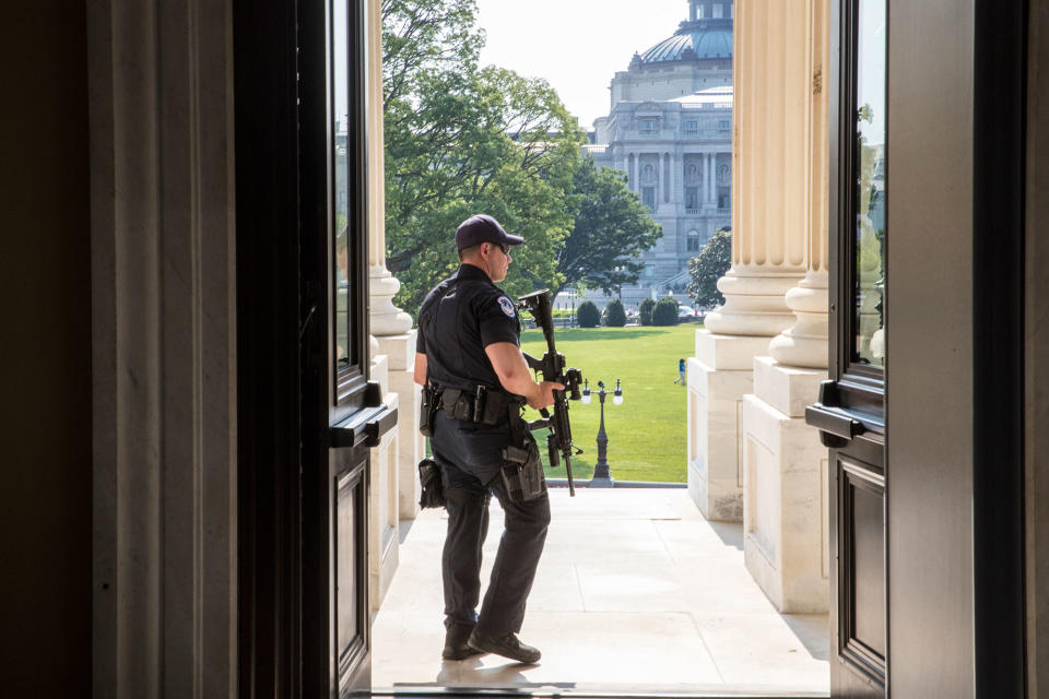 <p>A Capitol Hill Police officer stands his post at the entrance to the House of Representatives on Capitol Hill in Washington, Wednesday, June 14, 2017, after House Majority Whip Steve Scalise of La. was shot at a congressional baseball practice in Alexandria, Va. (Photo: J. Scott Applewhite/AP) </p>