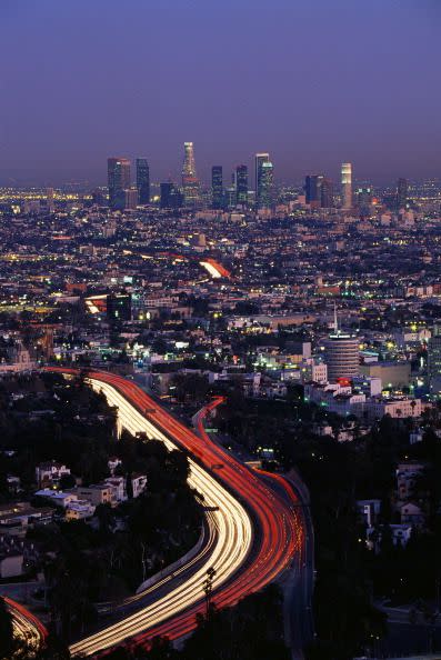 <p>It's pretty cool to see the city's freeways light up. The white stream of light is coming from people's headlights and the red are from taillights (Who knew traffic could be so beautiful?). </p>