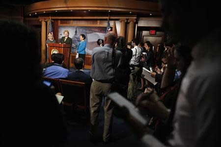 U.S. Senator Barbara Boxer (D-CA) (on stage, L-R), Senator Debbie Stabenow (D-MI) and Senator Mazie Hirono (D-HI) talk to reporters about provisions for women's health in the Affordable Care Act (commonly known as Obamacare) they say House Republicans are attempting to invalidate during the current fiscal battle at the U.S. Capitol in Washington, September 30, 2013. REUTERS/Jonathan Ernst