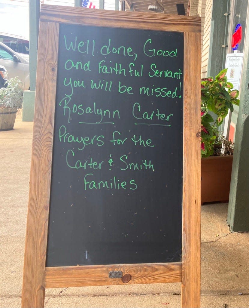 A sign sits outside of Southwest Trophy and Gifts on Main Street in Plains, Georgia on Monday, Nov. 20, 2023.