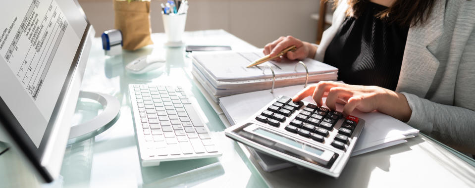 A woman using a calculator