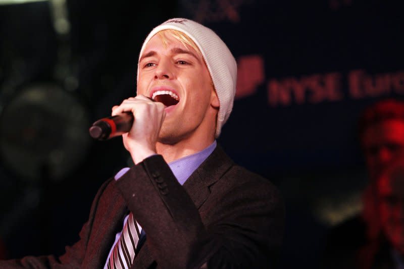 Aaron Carter of "The Fantasticks" Off-Broadway show performs at the New York Stock Exchange on the day of the 88th Annual NYSE Christmas Tree Lighting on Wall Street In 2011. File Photo by John Angelillo/UPI