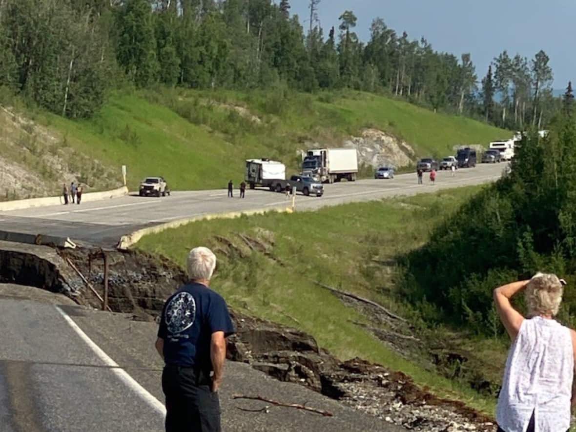 A section of the Alaska Highway in northern B.C. was washed out on Friday evening, restricting access to the Yukon by vehicle.   (Yukon Highways and Public Works/ Twitter - image credit)