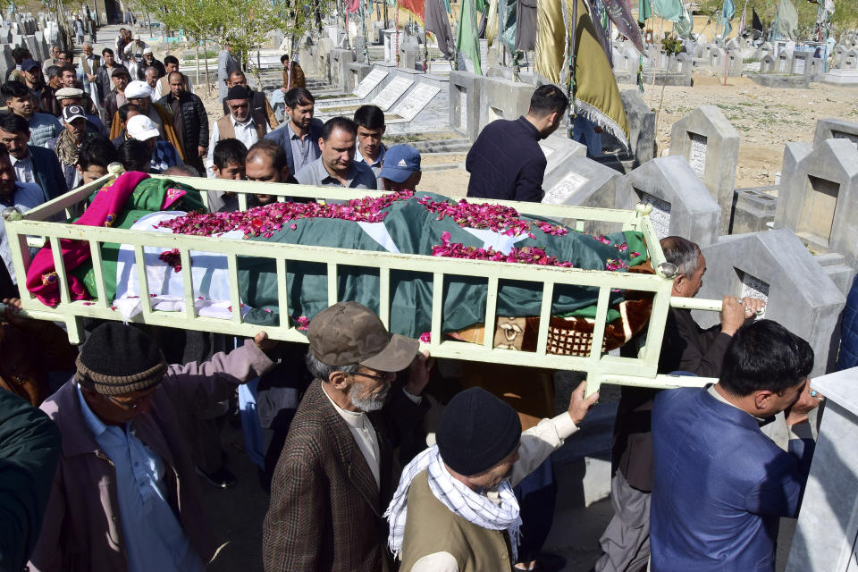 Relatives and mourners carry the coffin of female field hockey player Shahida Raza, who died in the shipwreck tragedy, for her funeral, in Quetta, Pakistan, Friday, March 17, 2023. Raza was among other migrants who died in a shipwreck off Italy's southern coast. The migrants' wooden boat, crammed with passengers who paid smugglers for the voyage from Turkey, broke apart in rough water just off a beach in Calabria. (AP Photo/Arshad Butt)