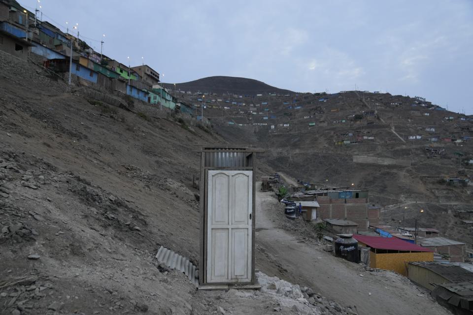 A portable toilet built by residents stands in the Pamplona Alta area in Lima, Peru, Friday, March 8, 2024. (AP Photo/Martin Mejia)