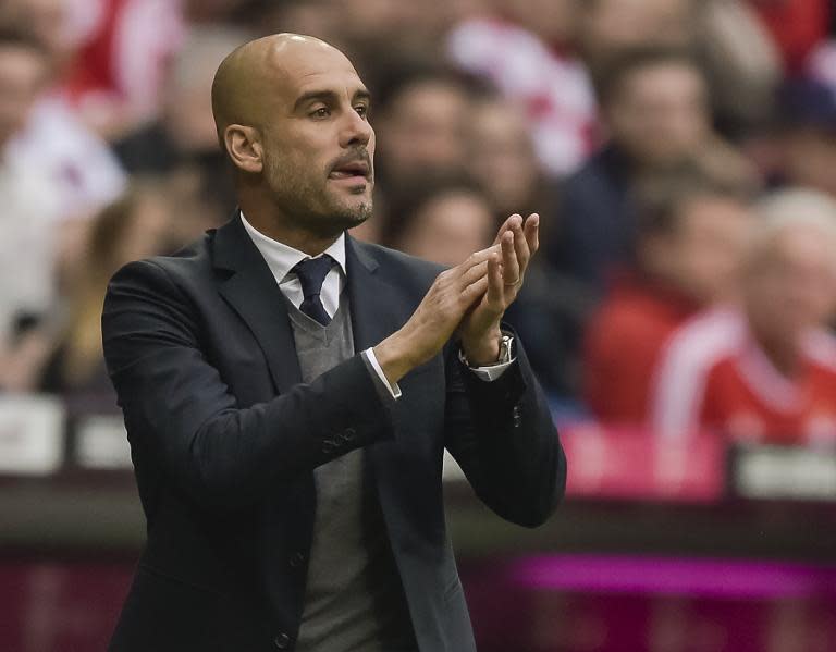 Bayern Munich's Spanish head coach Pep Guardiola reacts during a Bundesliga match between Bayern Munich and Hertha BSC Berlin at the Allianz Arena in Munich on April 25, 2015