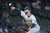 Oakland Athletics relief pitcher James Kaprielian throws against the Seattle Mariners in the fifth inning of a baseball game Monday, Sept. 27, 2021, in Seattle. (AP Photo/Elaine Thompson)