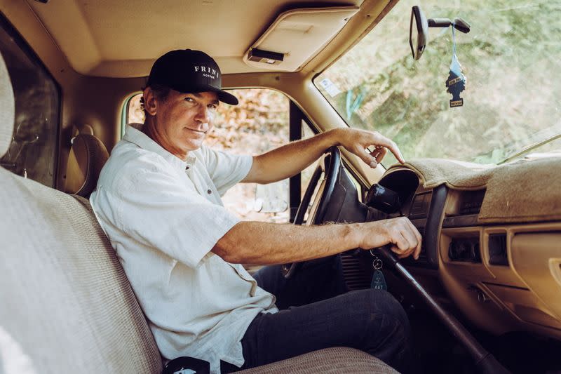 Farmer Jay Ruskey, the Chief Executive of FRINJ Coffee, drives his truck around his farm in California