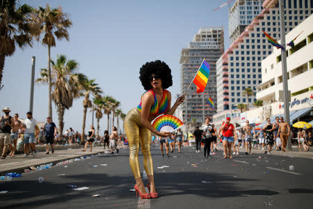 Revellers take part in a gay pride parade in Tel Aviv, Israel June 8, 2018. REUTERS/Corinna Kern