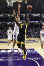 Iowa guard Joe Toussaint (1) goes to the basket as Northwestern center Ryan Young (15) defends during the second half of an NCAA college basketball game Tuesday, Jan. 14, 2020, in Evanston, Ill. (AP Photo/David Banks)