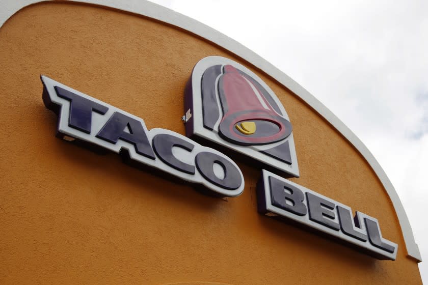 FILE - This Friday, May 23, 2014, file photo, shows the sign at a Taco Bell in Mount Lebanon, Pa. Ta