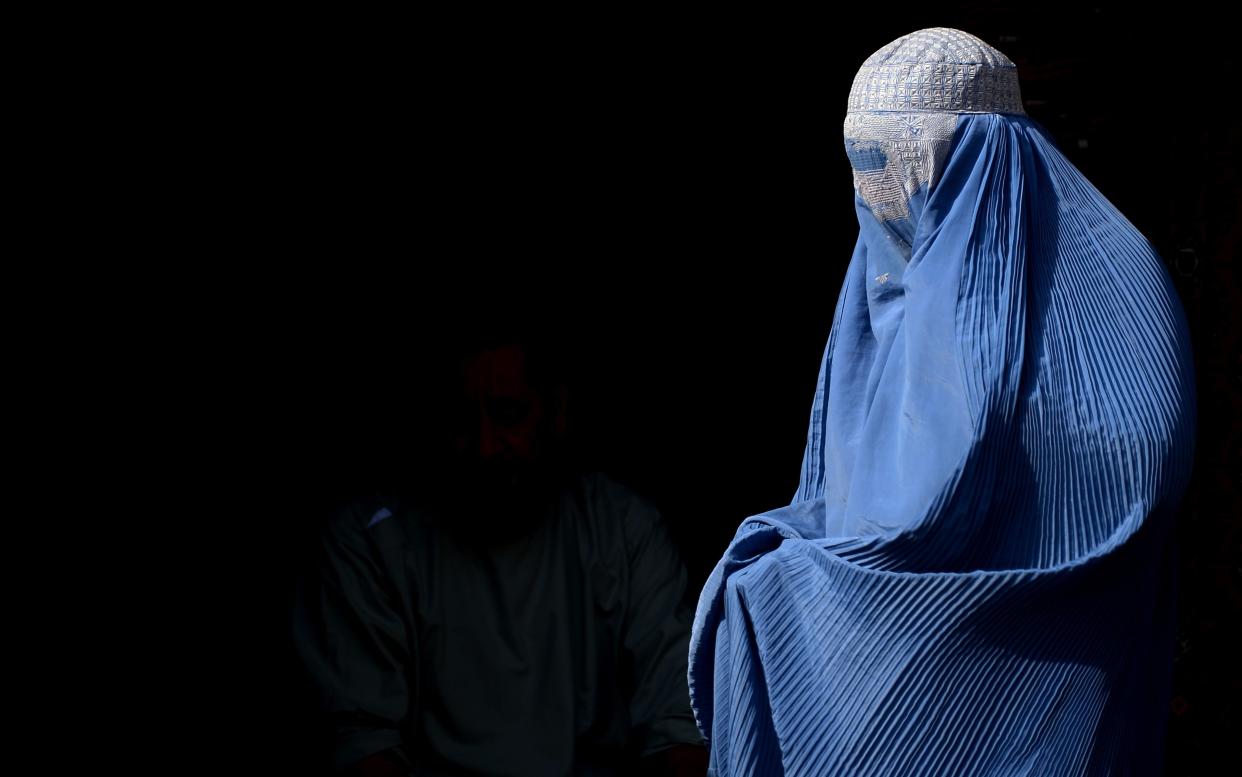 A woman wearing a burka in Herat, Afghanistan - AFP or licensors