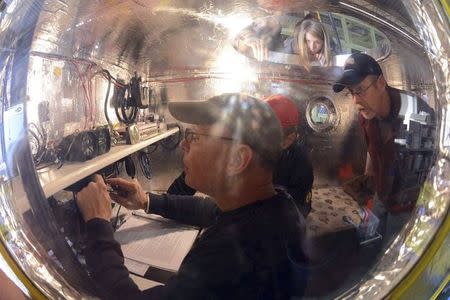 Bert Padelt (foreground) prepares the Two Eagles capsule for launch in Saga in this handout picture, received by Reuters on January 28, 2015, courtesy of Al Nels of the Two Eagles Balloon Team. REUTERS/Al Nels/Two Eagles Balloon Team/Handout via Reuters