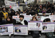 Participants hold pictures of the deceased Kim Bok-dong, one of the many former South Korean sex slaves who were forced to serve for the Japanese military in World War II, during a weekly rally near the Japanese Embassy in Seoul, South Korea, Wednesday, Jan. 30, 2019. Hundreds of South Koreans are mourning the death of a former sex slave for the Japanese military during World War II by demanding reparations from Tokyo over wartime atrocities. (AP Photo/Lee Jin-man)