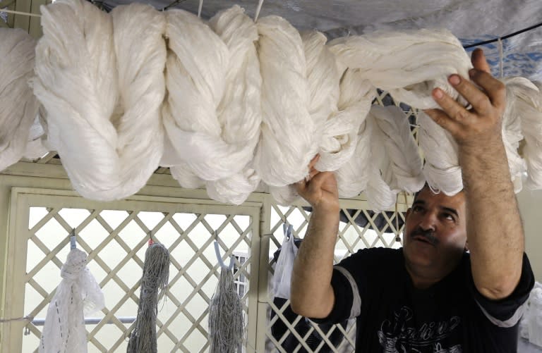 Mohammad al-Rihawi in his Damascus workshop on January 23, 2018, where trade has been hit due to Syria's civil war