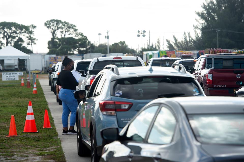 Dynix Diagnostix COVID-19 technician Aaliyah Hatcher registers people seeking free COVID tests Tuesday, Jan. 4, 2022, at the Martin County Fairgrounds in Stuart. The site, open seven days a week and 10 hours a day, tests 300 to 400 people per day, according to site manager James Haney. “There is such a high demand. We went from 20 to 30 a week to (this). It was overnight about three weeks ago,” he said. Dynix Diagnostix plans to open sites in Indiantown and Fort Pierce once they can staff the sites.