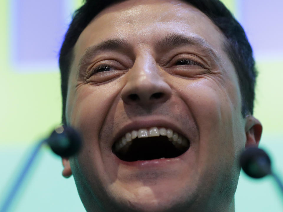 Ukrainian comedian and presidential candidate Volodymyr Zelenskiy speaks to the media and his supporters at his headquarters after the second round of presidential elections in Kiev, Ukraine, Sunday, April 21, 2019. A comedian whose only political experience consists of playing a president on TV appeared poised to reprise the role in real life when an exit poll showed him winning Ukraine's presidential runoff Sunday in a landslide. (AP Photo/Sergei Grits)