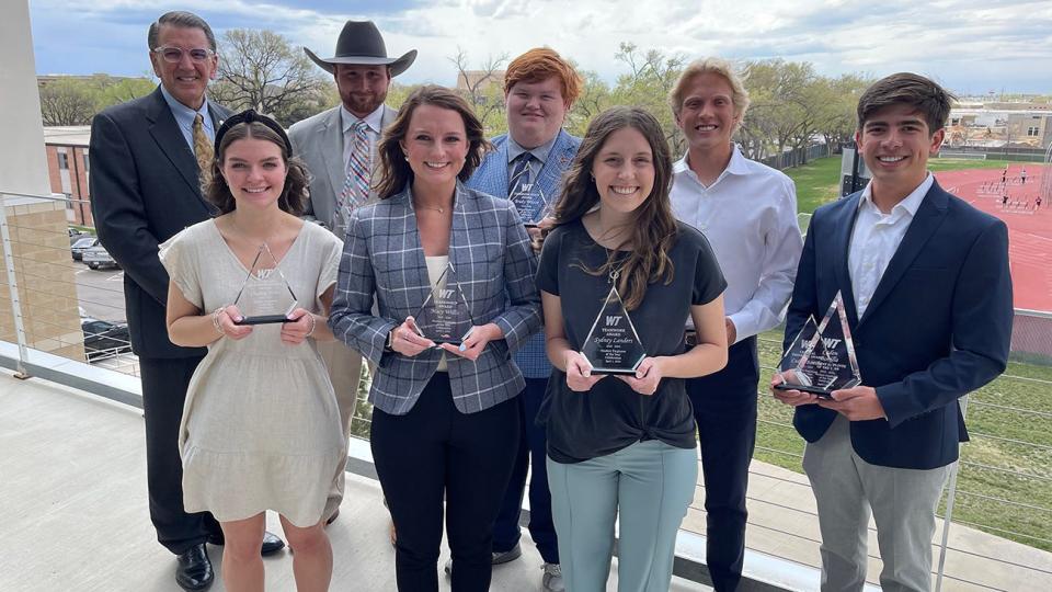 West Texas A&M University President Walter V. Wendler, back left, congratulates student employee award winners including, front from left, Charlee Jones, Macy Wilis and Sydney Landers and, back from second from left, Zane Phillips, Brady Wilson, Spencer Keys and Caden Bonilla.