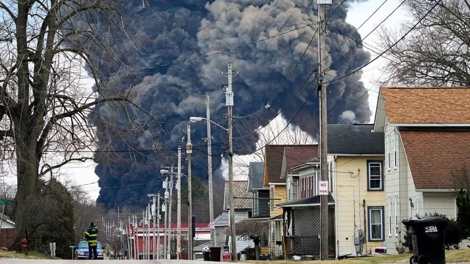 A black plume rose over East Palestine, Ohio, following a controlled detonation of a portion of the derailed Norfolk Southern trains on February 6. - Gene J. Puskar/AP