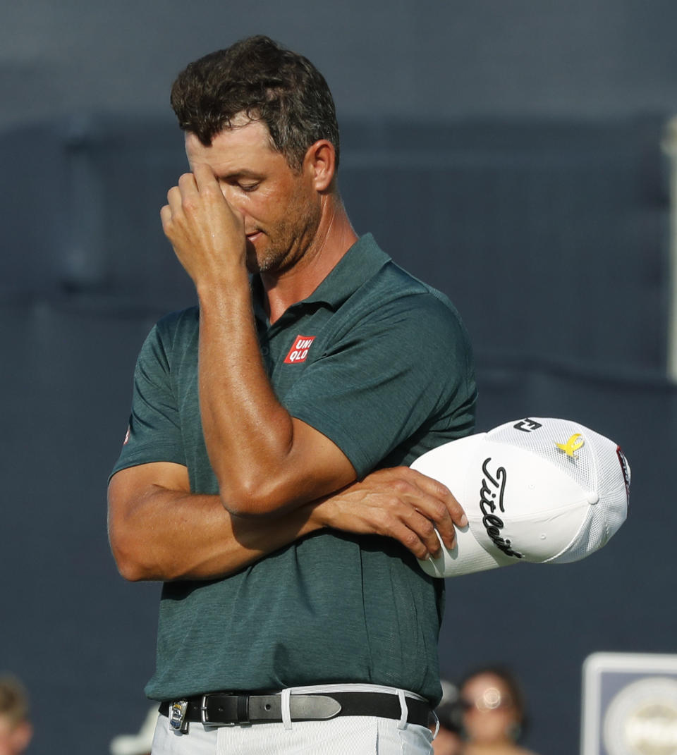 Adam Scott, of Australia, reacts after his missed putt on the 18th hole during the third round of the PGA Championship golf tournament at Bellerive Country Club, Saturday, Aug. 11, 2018, in St. Louis. (AP Photo/Brynn Anderson)