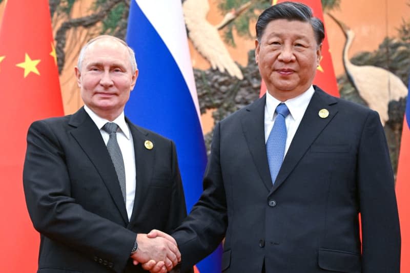 Russian President Vladimir Putin and Chinese President Xi Jinping meet on the sidelines of the Belt and Road Forum. Following the start of his fifth term in office, Russian President Vladimir Putin will travel to China this week for his first foreign visit. -/Kremlin/dpa