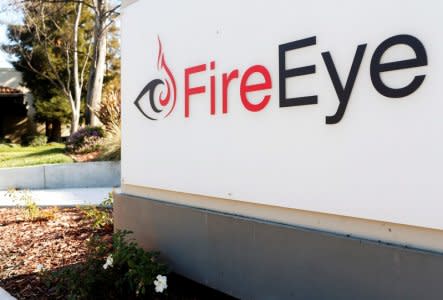 FILE PHOTO: The FireEye logo is seen outside the company's offices in Milpitas, California, U.S. December 29, 2014. REUTERS/Beck Diefenbach/File Photo