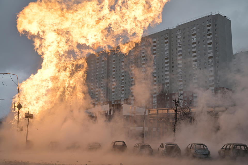 Fire and burnt-out cars are seen after a missile strike in Kyiv on January 2,2024, amid the Russian invasion of Ukraine. (Photo by Genya SAVILOV / AFP) (Photo by GENYA SAVILOV/AFP via Getty Images)